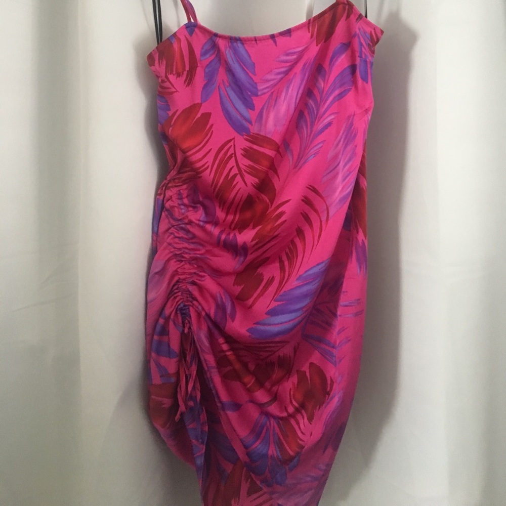 Spaghetti strap ruched mini dress.